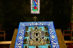 With stain-glass icon of St Patrick